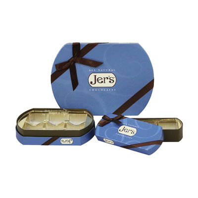 L'emballage elliptique de cadeau de chocolat de truffe de forme enferme dans une boîte le plateau intérieur démontable