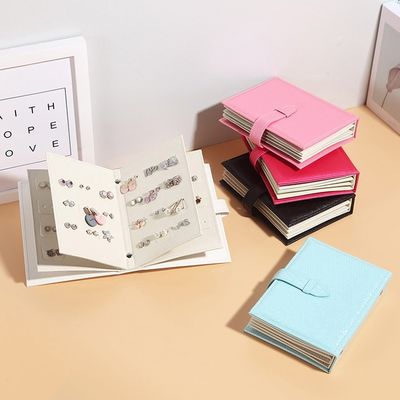 42 paires de boucles d'oreille de livre de stockage